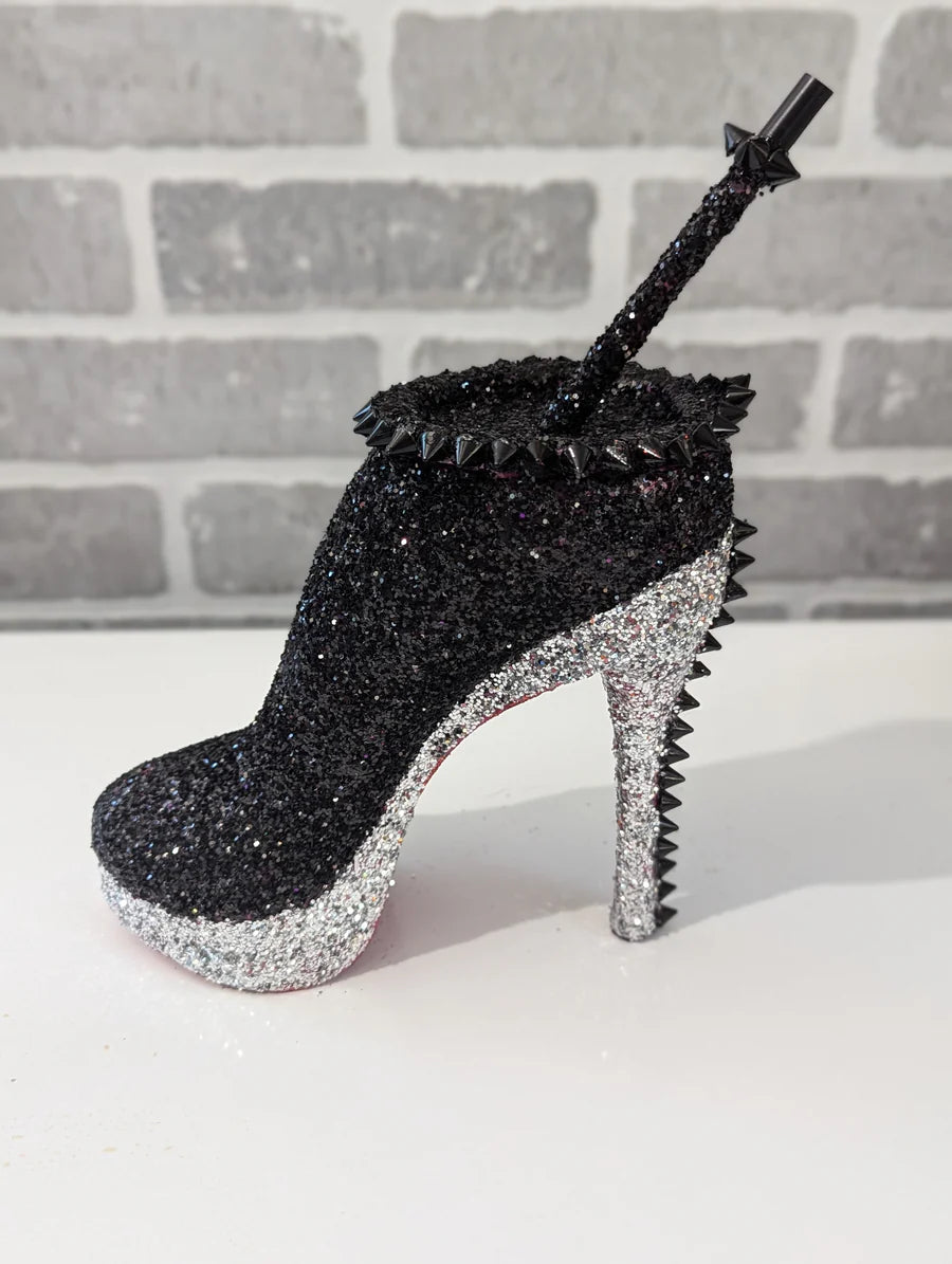 Decorative Silver Black Stiletto Heel Tumbler Cup with spikes and glitter, branded 'Vanity Home Decor', on a neutral background.