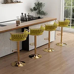 Set of green bar stools with gold bases in a kitchen setting