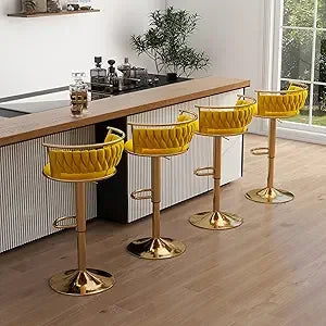 Yellow bar stools with gold bases in a kitchen setting