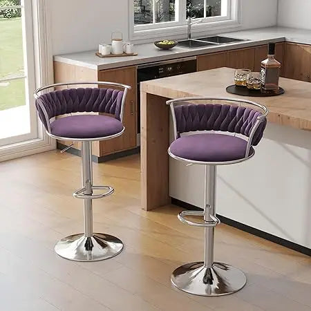 Two purple bar stools with chrome bases in a kitchen setting.
